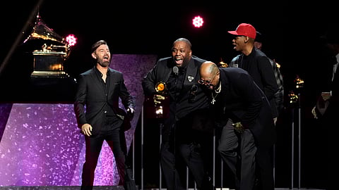 Killer Mike , center, celebrates as he accepts the award for best rap album for "Michael" during the 66th annual Grammy Awards on Feb. 4, 2024, in Los Angeles.
