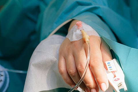 Image of a hospital patient's hand with an IV cannulation used for representational purposes only