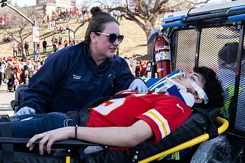 People attend a candlelight vigil for victims of a shooting at a Kansas City Chiefs Super Bowl victory rally Thursday, Feb. 15, 2024 in Kansas City
