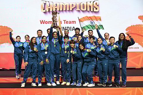 The victorious Indian women's badminton team after winning the title