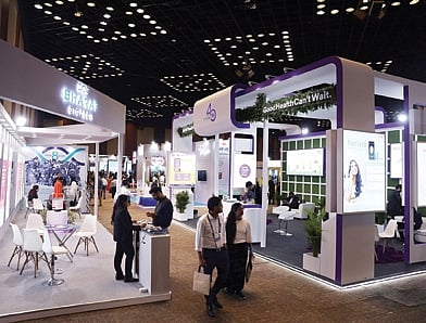 Delegates browse stalls on the first day of BioAsia 2024 at HICC in Hyderabad on Tuesday.