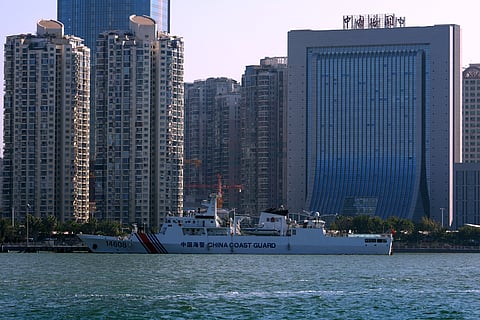 A Chinese Coast Guard ship is docked near a China Customs building in Xiamen in southeast China's Fujian province