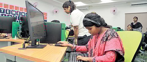 The computers are equipped with software and devices to allow disabled students to actively engage in classroom discussions and lectures.