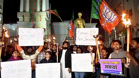 Activists of BJP Yuva Morcha stage a protest against TMC workers who allegedly disrespected the modesty of women in Sandeshkhali, in Kolkata, Saturday, Feb. 10, 2024.