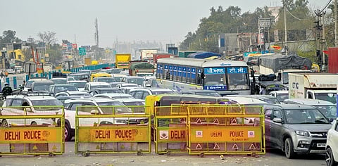 Traffic moves slowly at Delhi borders due to barricading by police 