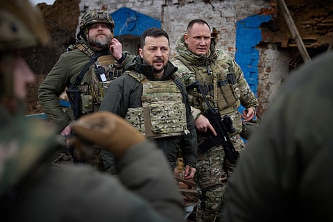Ukrainian President Volodymyr Zelenskyy, centre, during his visit to Zaporizhzhia region, the site of fierce battles with the Russian troops in Ukraine, Sunday, Feb. 4, 2024.