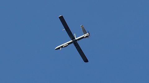 A picture taken from a position in southern Israel along the border with the Gaza Strip on February 15, 2024, shows an Israeli military drone flying above the Gaza Strip.