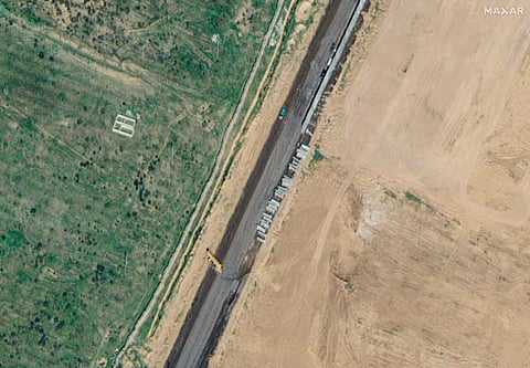 This satellite image provided by Maxar Technologies shows wall construction in Rafah, Egypt, Thursday, Feb. 15, 2024.
