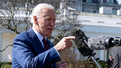 President Joe Biden talks with reporters before boarding Marine One on the South Lawn of the White House, Tuesday, Feb. 20, 2024, in Washington.