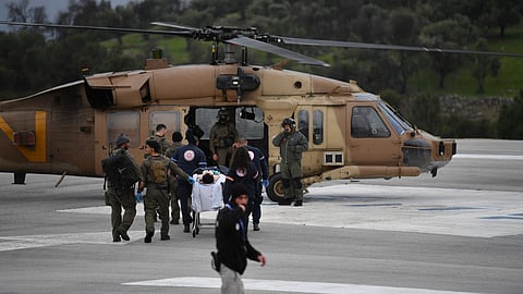 An Israeli medical team evacuate a person injured by a rocket fired from Lebanon, at Ziv hospital in Safed, northern Israel, Wednesday, Feb. 14, 2024. 