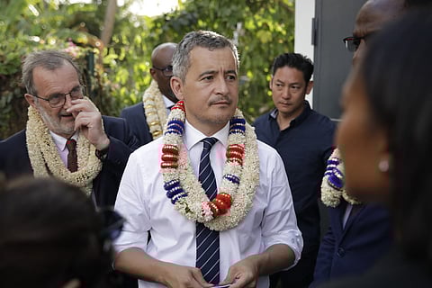 French Interior and Overseas Minister Gerald Darmanin (C) attends a visit to a surveillance centre in Mamoudzou, on the French Indian Ocean island of Mayotte, on June 25, 2023.