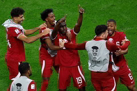Almoez Ali celebrates scoring his team's third goal during the Asian Cup semi-final against Iran (Photo | AFP)