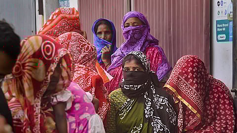 Sandeshkhali women wait to meet a National Commission for Women (NCW) representative. 