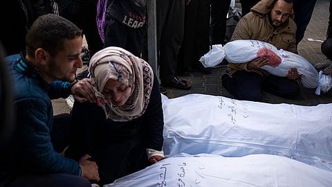 Palestinians mourn relatives killed in the Israeli bombardment of the Gaza Strip at a hospital morgue in Rafah.