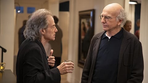 This image released by HBO shows Richard Lewis, left, with Larry David in a scene from Season 10 of “Curb Your Enthusiasm.” 