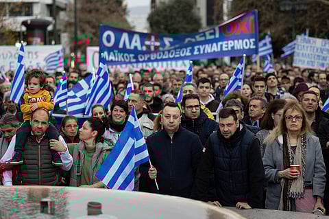 Protesters take part in a rally against same-sex marriage, at central Syntagma square, in Athens, Greece, Sunday, Feb. 11, 2024.