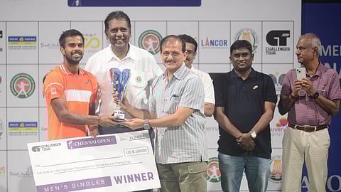 Additional Chief Secretary to Government of Tamil Nadu (Youth Welfare and Sports Development) Atulya Misra (c) & TNTA president Vijay Amritraj with ATP Chennai Challenger winner Sumit Nagal (L) on Sunday. 