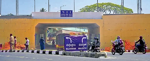The eight-lane corridor, built at a cost of Rs 102 crore, at Okalipuram Junction. 
Top: The railway underbridge. Work started on the project in 2015 