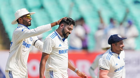 India's Mohammed Siraj with team-mates celebrates the wicket of England's Ben Foakes during the 3rd day of the 3rd cricket test match between India and England, at Niranjan Shah Stadium, in Rajkot, Saturday, Feb. 17, 2024.