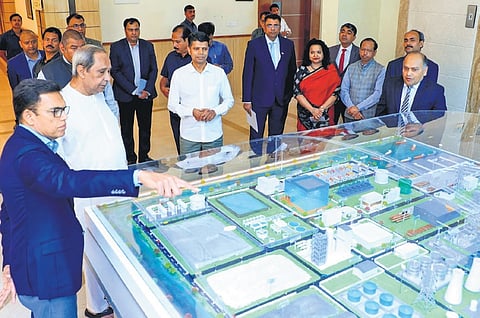 JSW chairman Sajjan Jindal briefing CM Naveen Patnaik about the EV project on Saturday