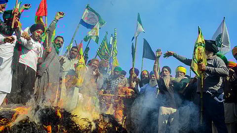 Farmers burn effigies during the 'Black Day' protest at the Punjab-Haryana Shambhu border, in Patiala district, Friday, Feb. 23, 2024. Farmers are observing 'Black Day' following the death of a farmer at Khanauri border in Sangrur district.
