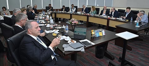 IBS Software executive chairman V K Mathews interacts with the Soft Power Club members during their visit to IBS Software complex