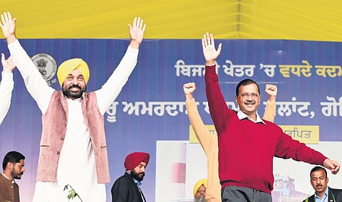 Punjab CM Bhagwant Mann and Delhi CM Arvind Kejriwal at a rally to inaugurate Guru Amardas Thermal Power Plant in Tarn Taran district of Punjab on Sunday.