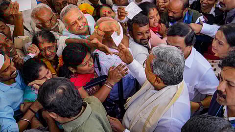 : Karnataka Chief Minister Siddaramaiah interacts with the public during the second state-level Janaspandana, a public grievance redressal meeting, at Vidhana Soudha, in Bengaluru, Thursday, Feb. 8, 2024. 