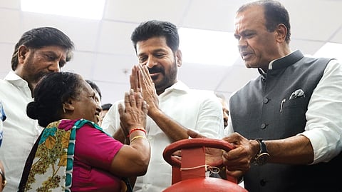 Chief Minister A Revanth Reddy greets a woman beneficiary during the launch of the Mahalakshmi and Gruha Jyothi schemes at Telangana Secretariat on Tuesday.