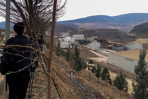 Journalists work next to the Copler gold mine near Ilic village, east Turkey, Tuesday, Feb. 13, 2024.