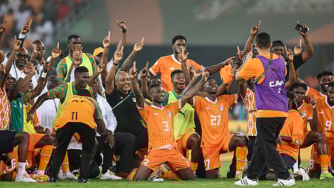 Ivory Coast's players celebrate after winning at the end of the Africa Cup of Nations (CAN) 2024 semi-final football match between Ivory Coast and Democratic Repuplic of Congo on February 7, 2024.