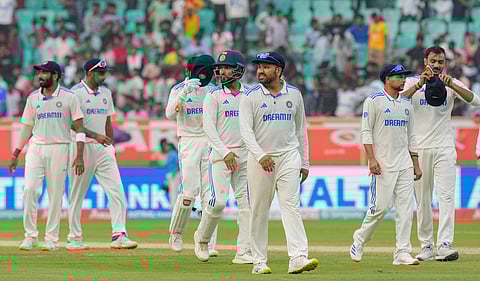 With England having nine wickets and two days to chase, India captain Rohit
Sharma (centre) and his bowlers have their task cut out on Monday, Feb 5, 2024.