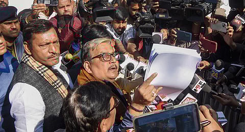RJD MP Manoj Jha along with Bihar Congress President Akhilesh Singh talks to the media persons outside former Bihar Deputy CM and RJD leader Tejashwi Yadav's residence, ahead of Nitish government's floor test, in Patna, Sunday, Feb. 11, 2024.