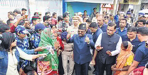 Governor CV Ananda Bose interacts with protestors at Sandeshkhali block.