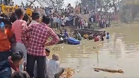 Rescue operation underway after a tractor-trolley fell into a pond, in Kasganj district on Saturday.