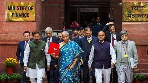 Union Finance Minister Nirmala Sitharaman with Ministers of State Bhagwat Kishanrao Karad and Pankaj Chaudhary, and other officials outside the Finance Ministry ahead of the presentation of Interim Budget 2024, in New Delhi.