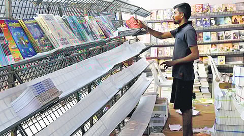 A day before the 36th Hyderabad Book Fair is thrown open to the public, an organiser arranges stalls at NTR Grounds on Thursday.