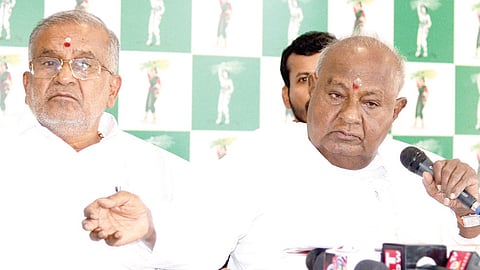 JDS supremo HD Deve Gowda interacts with reporters at the party office in Bengaluru on Sunday. MLA GT Devegowda looks on 