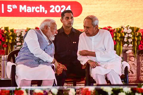 Prime Minister Narendra Modi share a moment with Chief Minister Naveen Patnaik.