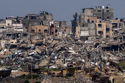 Destroyed buildings stand inside Gaza Strip, as seen from southern Israel.
