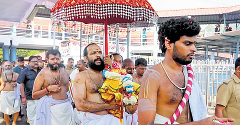 Thantri Kandararu Mahesh Mohanaru leading the procession carrying brahmakalasam as part of kalabhabhishekam ritual at Sabarimala temple | express