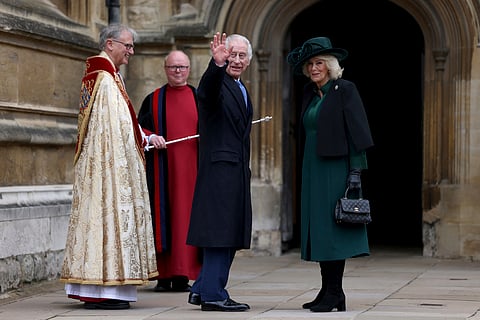 Britain's King Charles III, center, and Queen Camilla arrive to attend the Easter Matins Service at St. George's Chapel, Windsor Castle, England, Sunday, March 31, 2024.