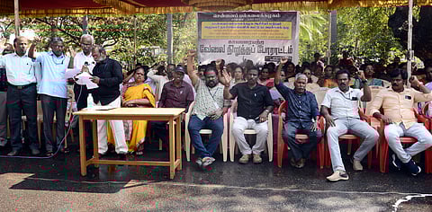 Employees of University of Madras staged a protest at the main gate demanding intervention of the state government in resolving the financial crisis of varsity.