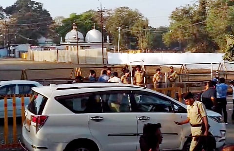 Security personnel stand guard outside Bhojshala/Kamal Maula Mosque complex after a team of the Archaeological Survey of India (ASI) reached the complex for a survey, in Dhar, Friday, March 22, 2024.