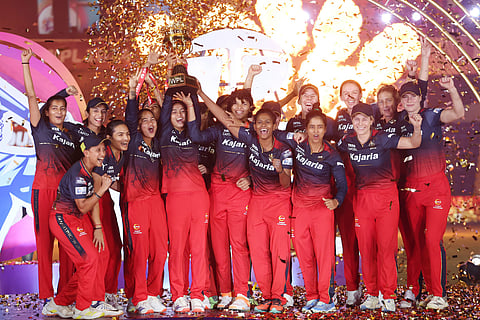 Royal Challengers Bangalore players celebrate after winning the WPL-T20 final cricket match against Delhi Capitals