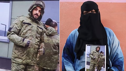 A photo of Indian national Mohammed Asfan, seen wearing Russian military fatigues, being held by his family member in Hyderabad.