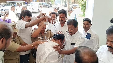 DMK Councillor Kajamalai Vijay attempted self immolation in front of Tiruchy City Corporation main office on Wednesday.