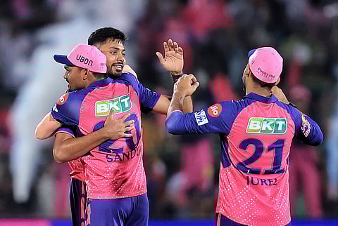 Rajasthan Royals bowlers Avesh Khan and Sandeep Sharma celebrate after winning the match against Delhi Capitals during the IPL 2024 T20 cricket match on March 28, 2024.