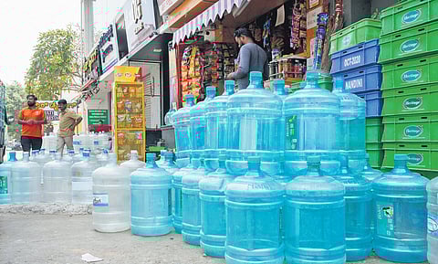 Empty water cans kept outside a shop near Domlur, as the water problem grows in Bengaluru on Sunday.