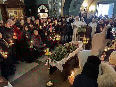 Relatives and friends pay their last respects at the coffin of Russian opposition leader Alexei Navalny in the Church of the Icon of the Mother of God Soothe My Sorrows, in Moscow, Russia, Friday, March 1, 2024.